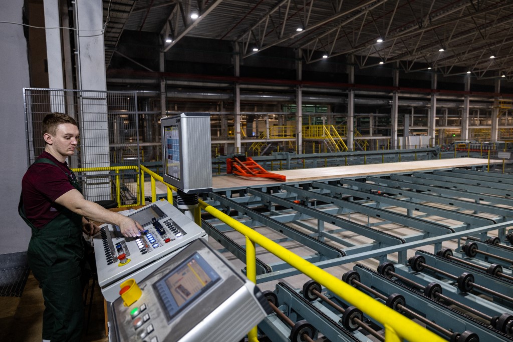 This picture taken on March 16, 2021, shows a worker controls a conveyor for cross-laminated timber at Sokol Timber Company near Vologda. – AFP pic