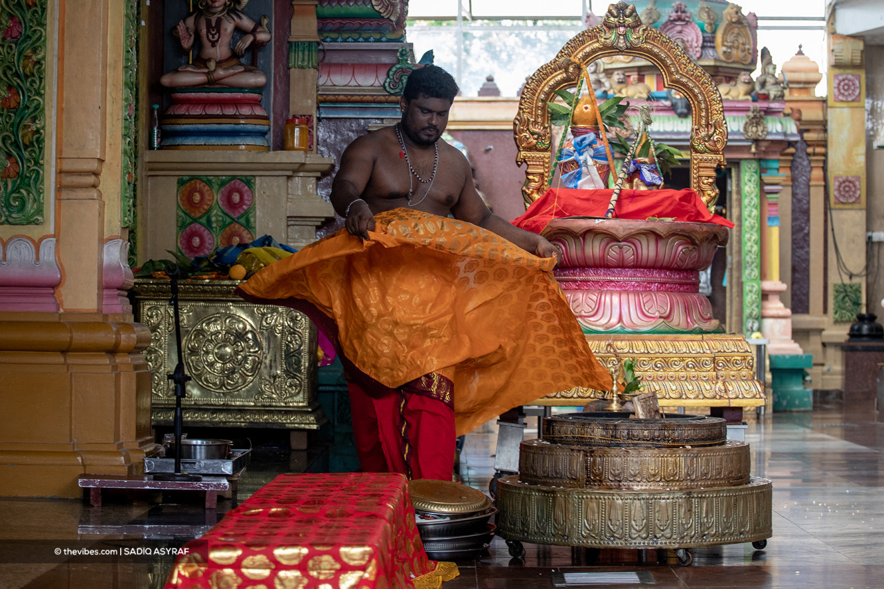 A Hindu temple priest among those in charge of cleaning and beautifying an establishment to welcome visitors in conjunction with Deepavali. – SADIQ ASYRAF/The Vibes pic, November 4, 2021