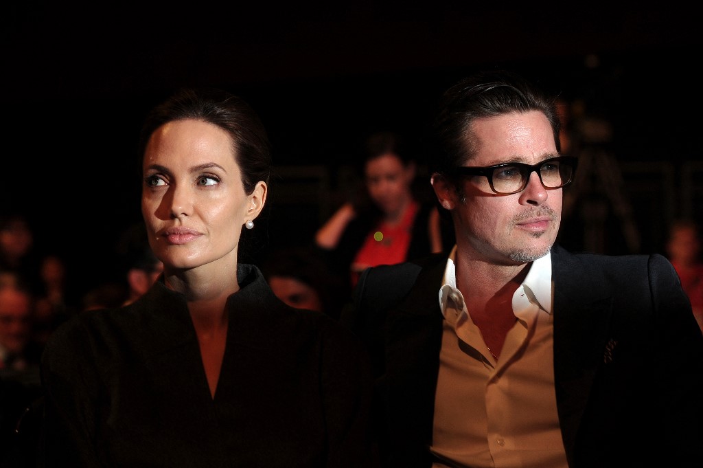 In this file photo taken on June 13, 2014 actress and special UN envoy Angelina Jolie (L) and her husband actor Brad Pitt attend the fourth day of the Global Summit to End Sexual Violence in Conflict, in London. – AFP pic