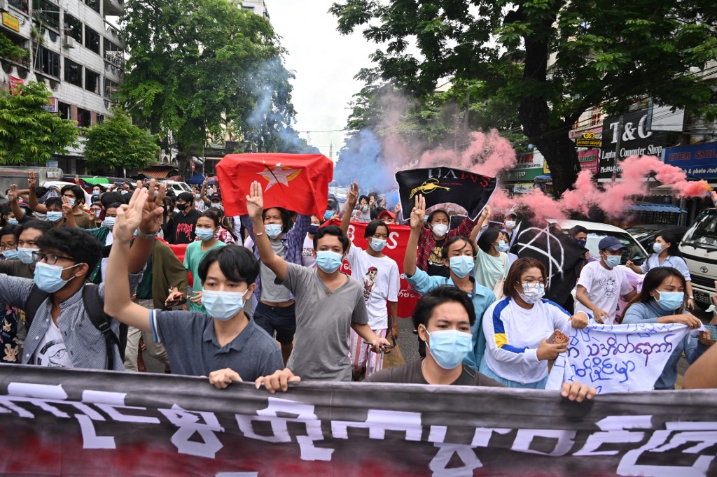 In this file photo taken on July 7, 2021, protesters make the three-fingered salute during a demonstration against the military coup in Yangon. – AFP pic