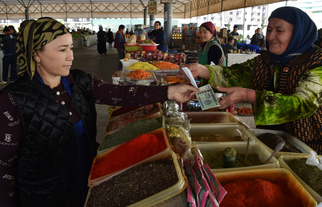 A woman selling spices for plov, at a bazaar in Termez, some 800km from Tashkent, on October 19, 2021. – AFP pic