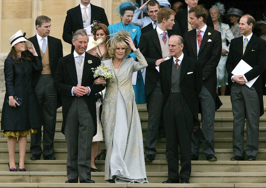 The then Prince Charles stands with Camilla Duchess of Cornwall on the steps of St. George's Chapel in Windsor following the church blessing of their civil wedding ceremony, on April 9, 2005. – AFP pic