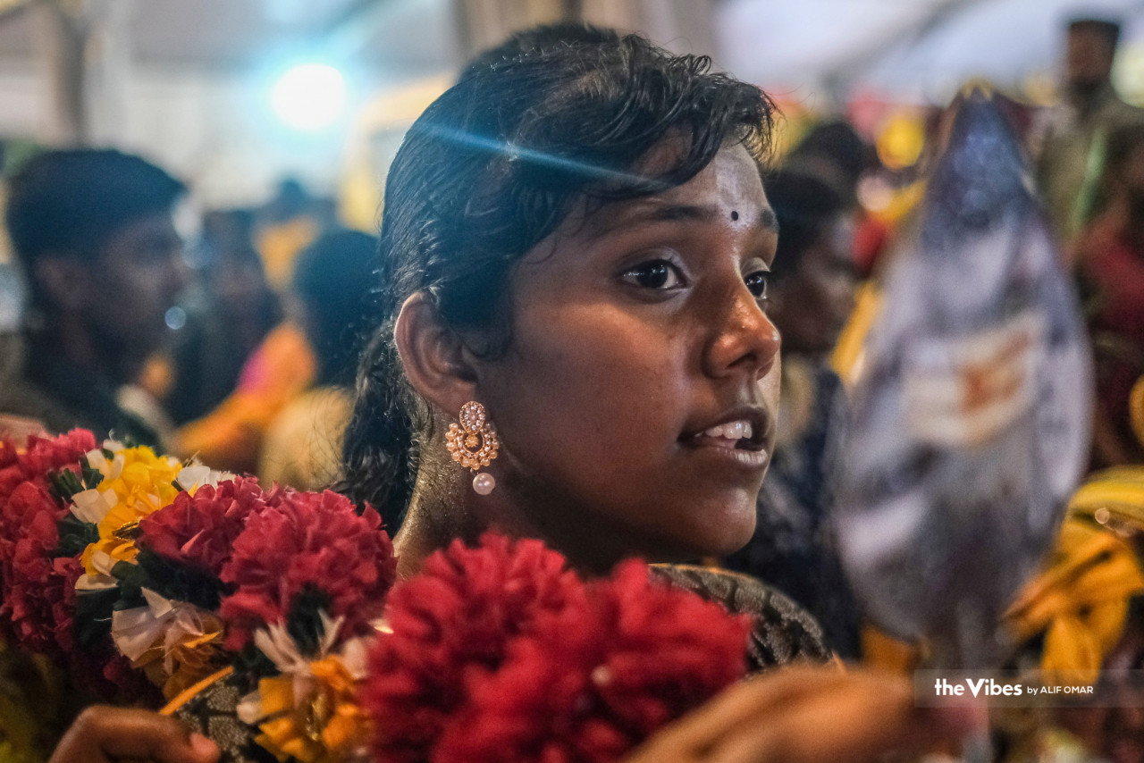Devotee seen in a beautiful flower garland at the Sri Subramanian Temple Batu Caves. – Alif Omar/The Vibes pic