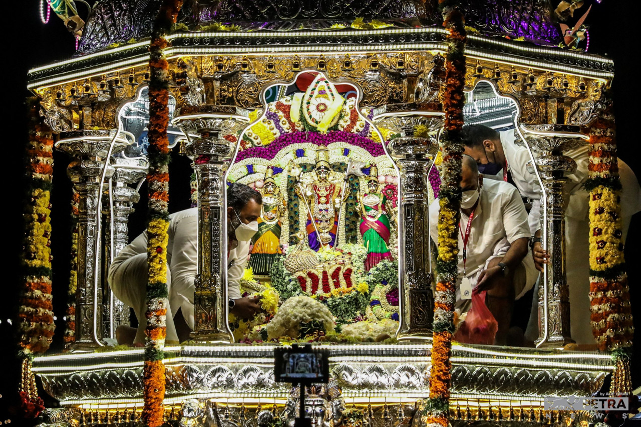The ‘Utsava Murti’ of Lord Murugan and his two consorts (Valli and Deivanai) seen on the silver chariot. To some, the Thaipusam procession is a retelling of Lord Shiva and Goddess Parvathi pacifying Lord Murugan. — The Vibes/Alif Omar pic