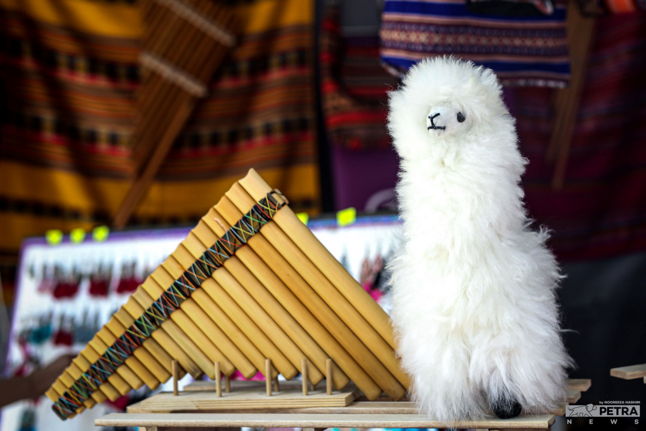 A traditional Peruvian musical flute instrument and an alpaca plush toy. – The Vibes pic/Nooreeza Hashim