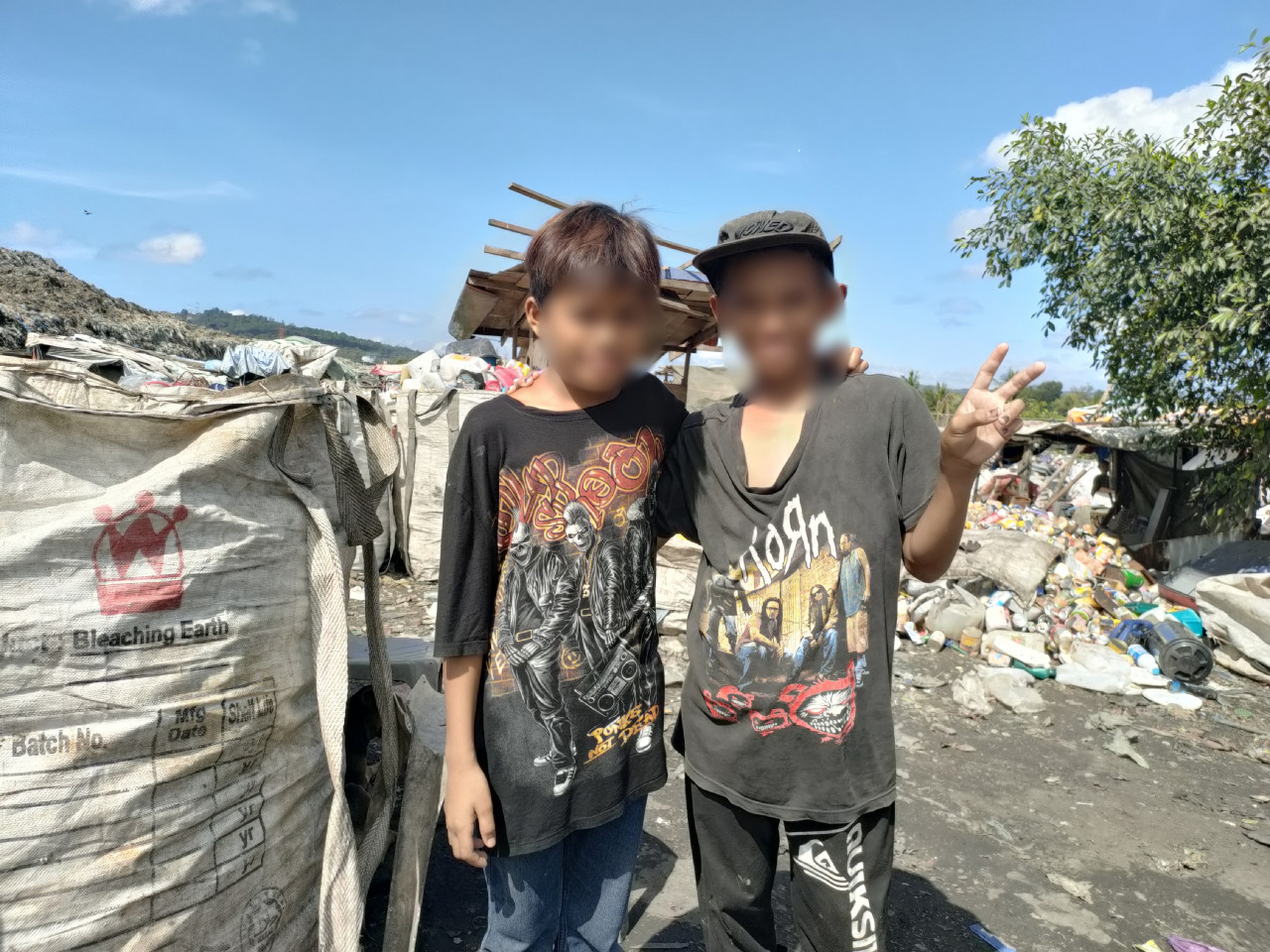 Adam (R) is happy to have his picture taken with his friend. – Pic by Rebecca Chong