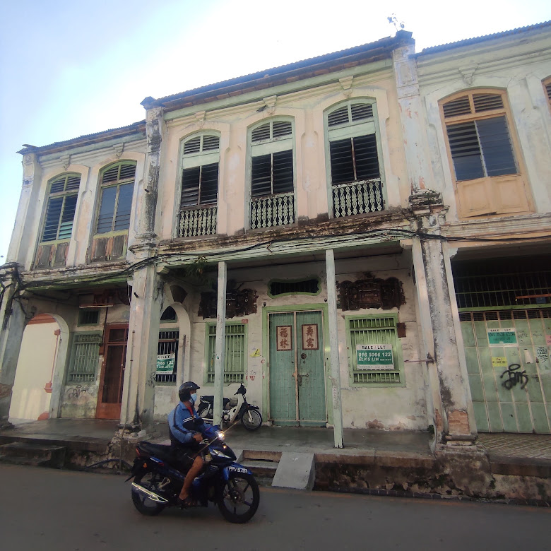 For sale... a shop house with Chien Nien artwork on Love Lane in Penang. – Pic by Maria J Dass