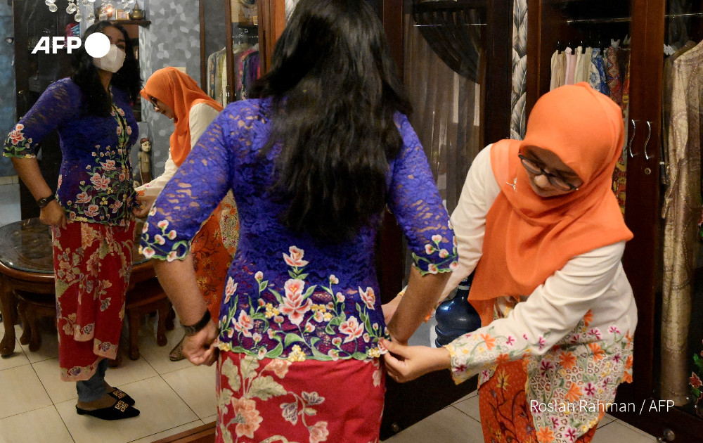 Kebayas were traditionally worn to formal events, but are seeing a steady comeback among those who wear them in daily life. – AFP pic
