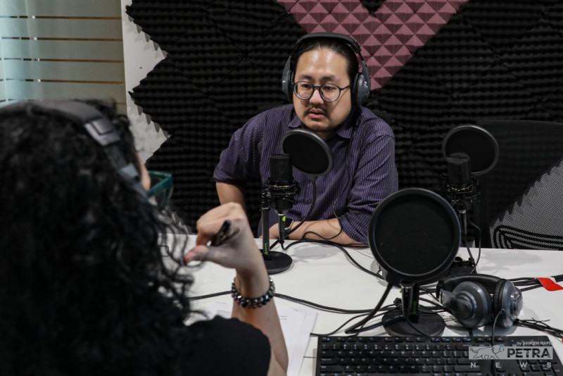 Dr Joel Low drops some knowledge in the podcast booth. – The Vibes file pic