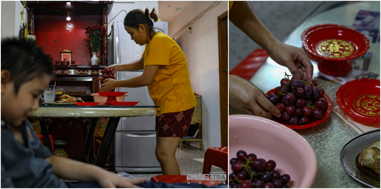 Inside the Soh family home, Xing helps to prepare the prayer offerings, while her sons are in the foreground waiting patiently in the living space until their parents are done with the morning rituals. — The Vibes/Azim Rahman pic