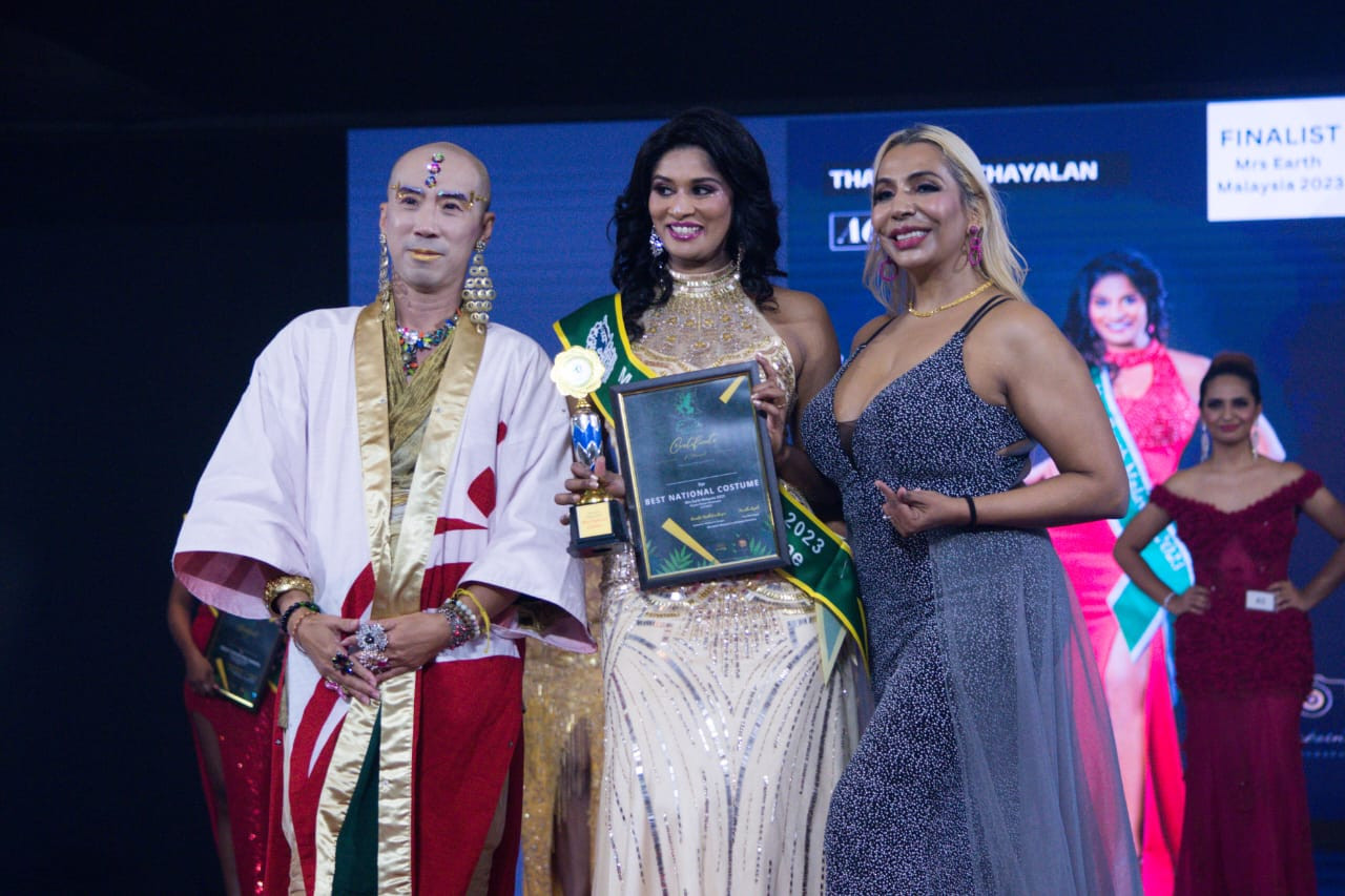 Francis Yip with winner Than Kuyil Thayalan and organiser Ammetta Malhotra Bergin. – Ian McIntyre pic