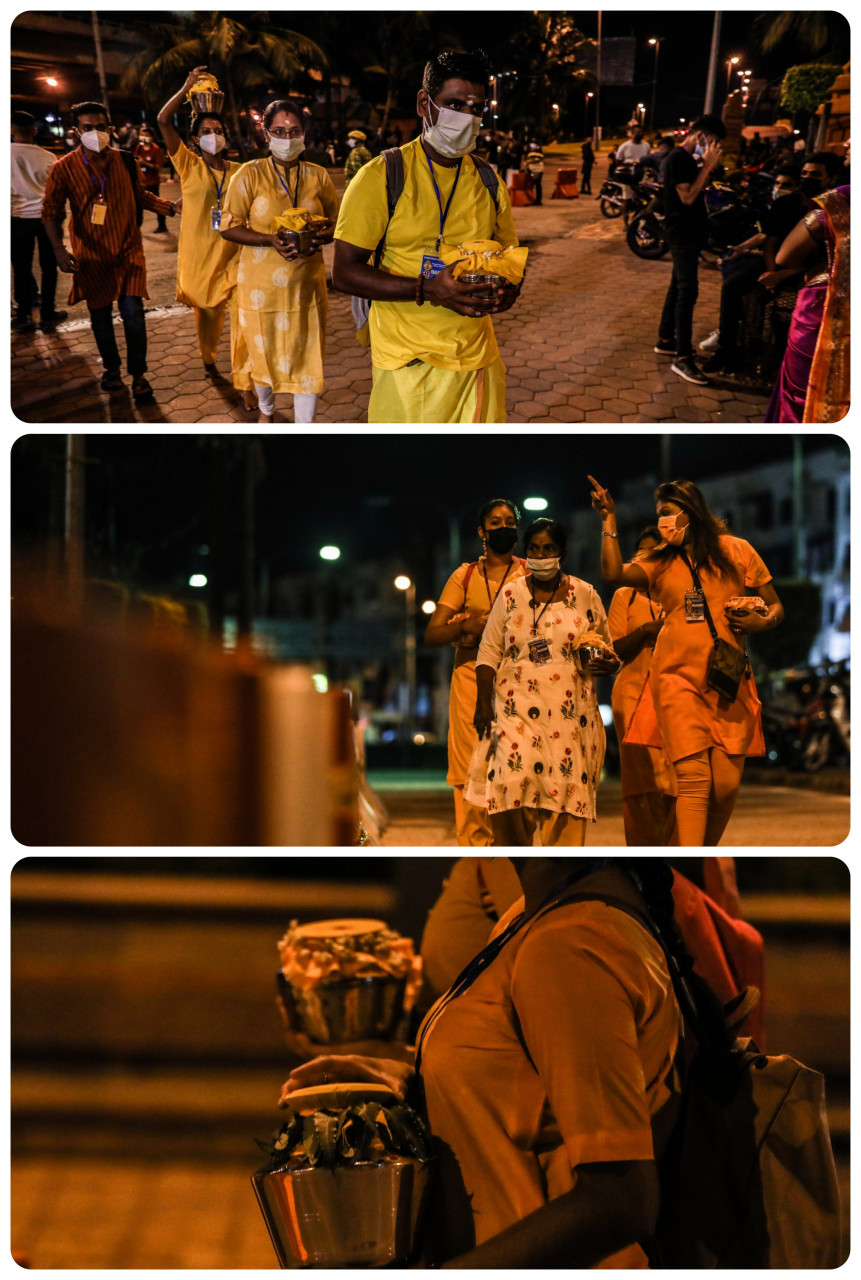 More devotees arrive at Batu Caves awaiting the arrival of the silver chariot. They are seen holding milk pots. — The Vibes/Alif Omar pic