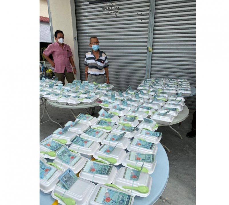 [UPDATED] Cops to probe viral photo of RM50 notes attached to food packages