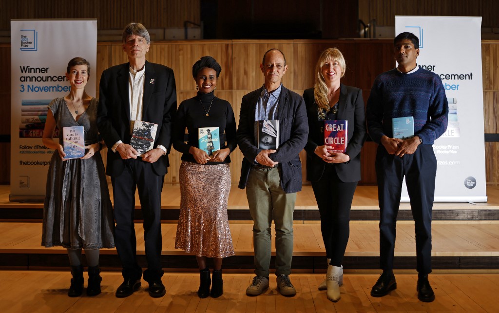 Nominees for the 2021 Booker Prize for Fiction, (from L), US author Patricia Lockwood, US author Richard Powers, British-Somali author Nadifa Mohamed, South African author Damon Galgut, US author Maggie Shipstead and Sri Lankan author Anuk Arudpragasam, pose with their books during the photo call for the authors shortlisted, at the Southbank Centre in London on October 31. – AFP pic