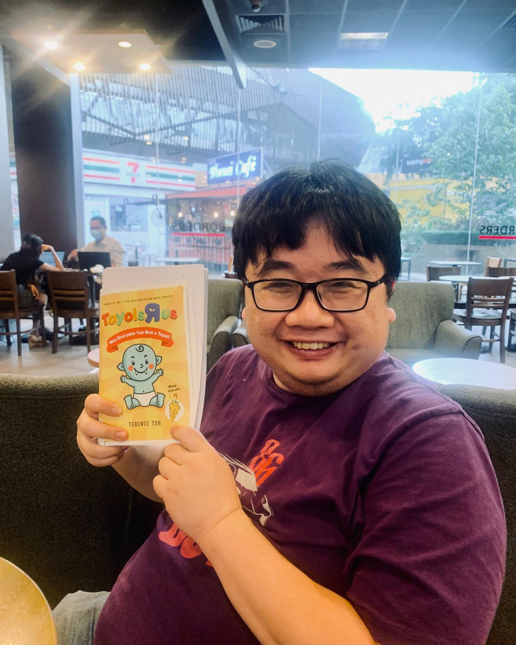 Author Terence Toh posses with his book. – Facebook pic