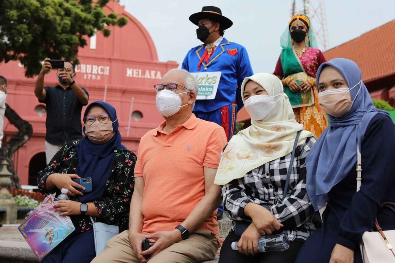 Datuk Seri Najib Razak (centre) seen attending programmes in Melaka a week ahead of nomination day, despite the Health Ministry ban on any form of election-related physical gatherings. – Najib Razak Facebook pic, October 31, 2021