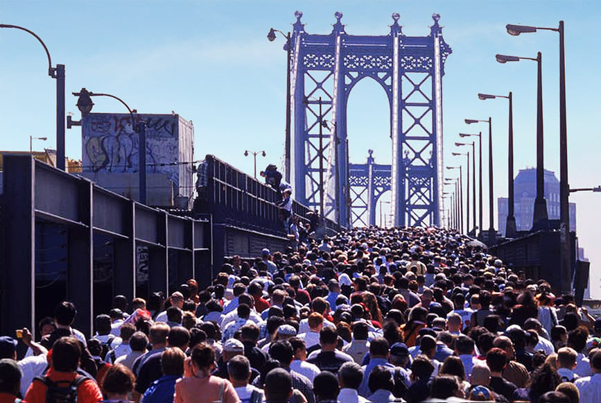 Throngs of people walk across the Williamsburg Bridge towards Brooklyn. These people were told to evacuate from lower Manhattan. – Pic courtesy of Kirby Tan