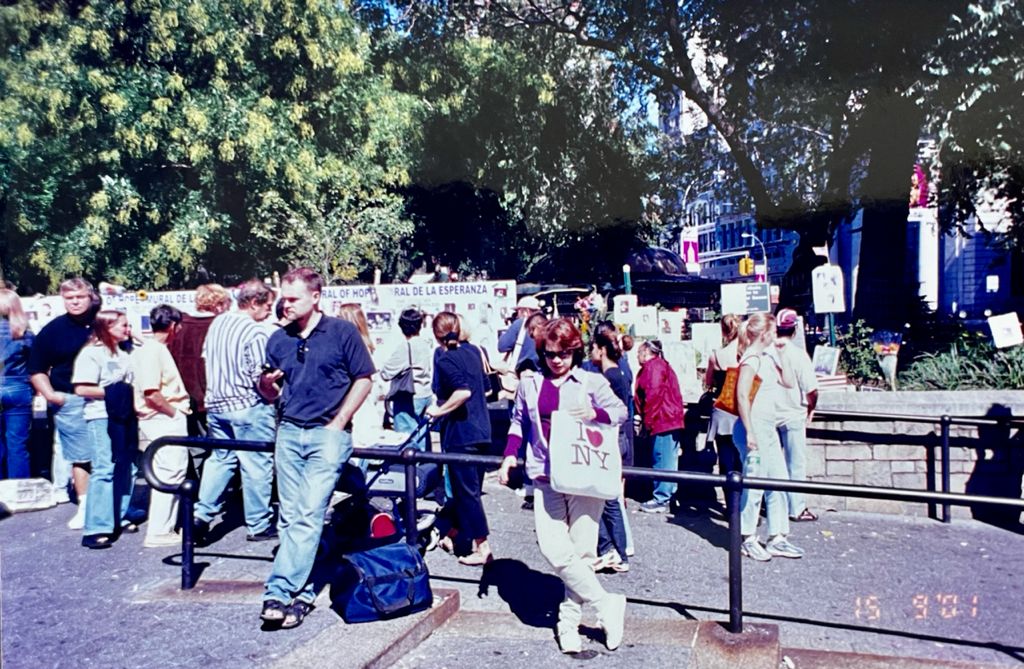 Tan Sri Noorul Ainur Mohd Nur (in purple) visiting Union Square in Manhattan, on September 15, 2001, as crowds peruse the pictures of those missing in the attacks. – Pic courtesy of Noorul Ainur Mohd Nur