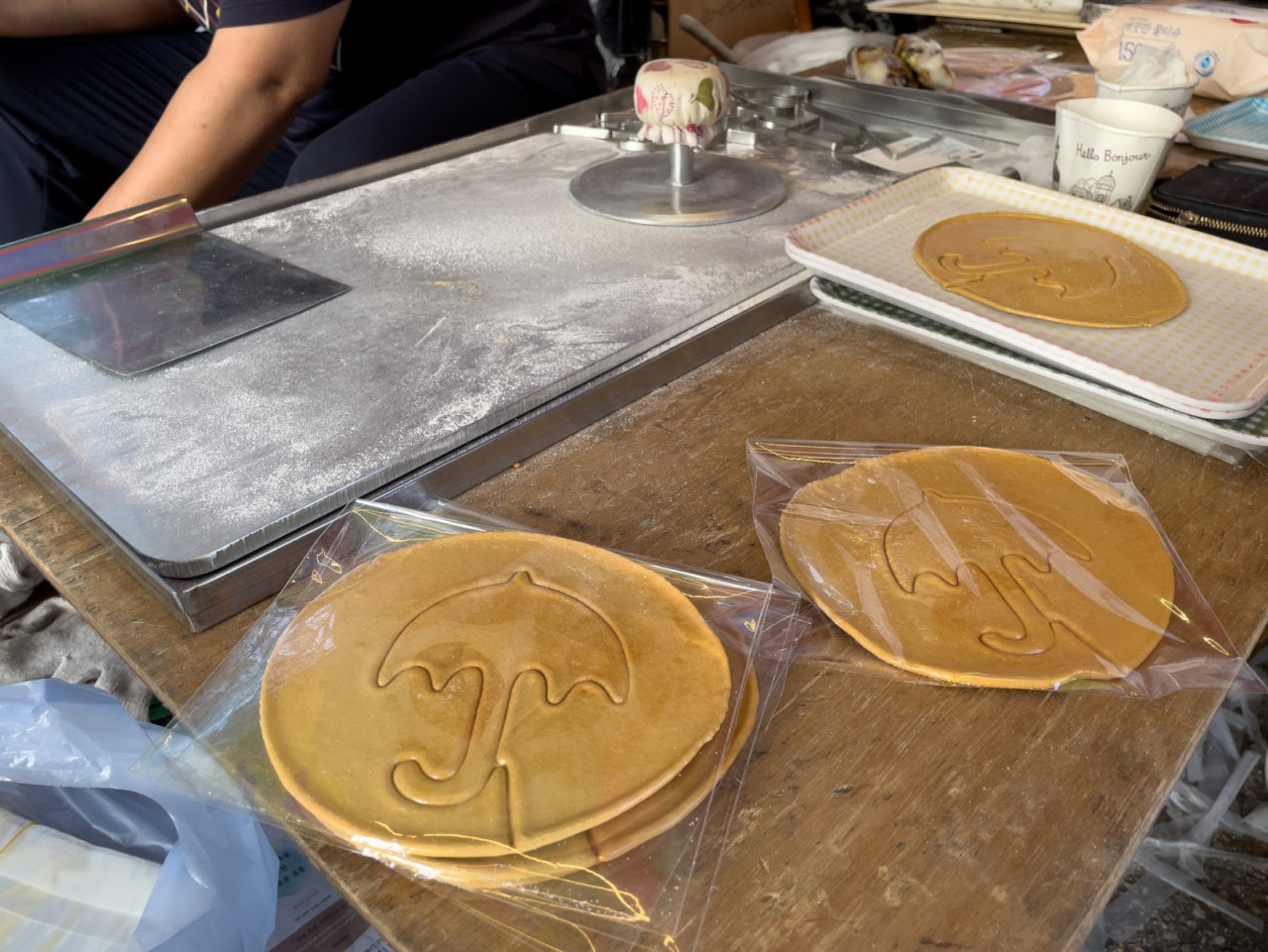 In this picture taken in Seoul on October 10, wrapped dalgonas, a crisp sugar candy featured in 'Squid Game', are seen at the street stall of Lim Chang-joo and his wife Jung Jung-soon, for which they were hired to be on set to make during production. – AFP pic, October 11, 2021
