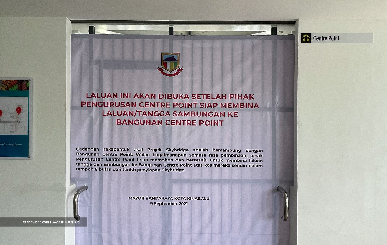 A notice put up on the KK Skybridge saying the Centre Point Sabah management will build an access point to the mall. – JASON SANTOS/The Vibes pic, September 9, 2021