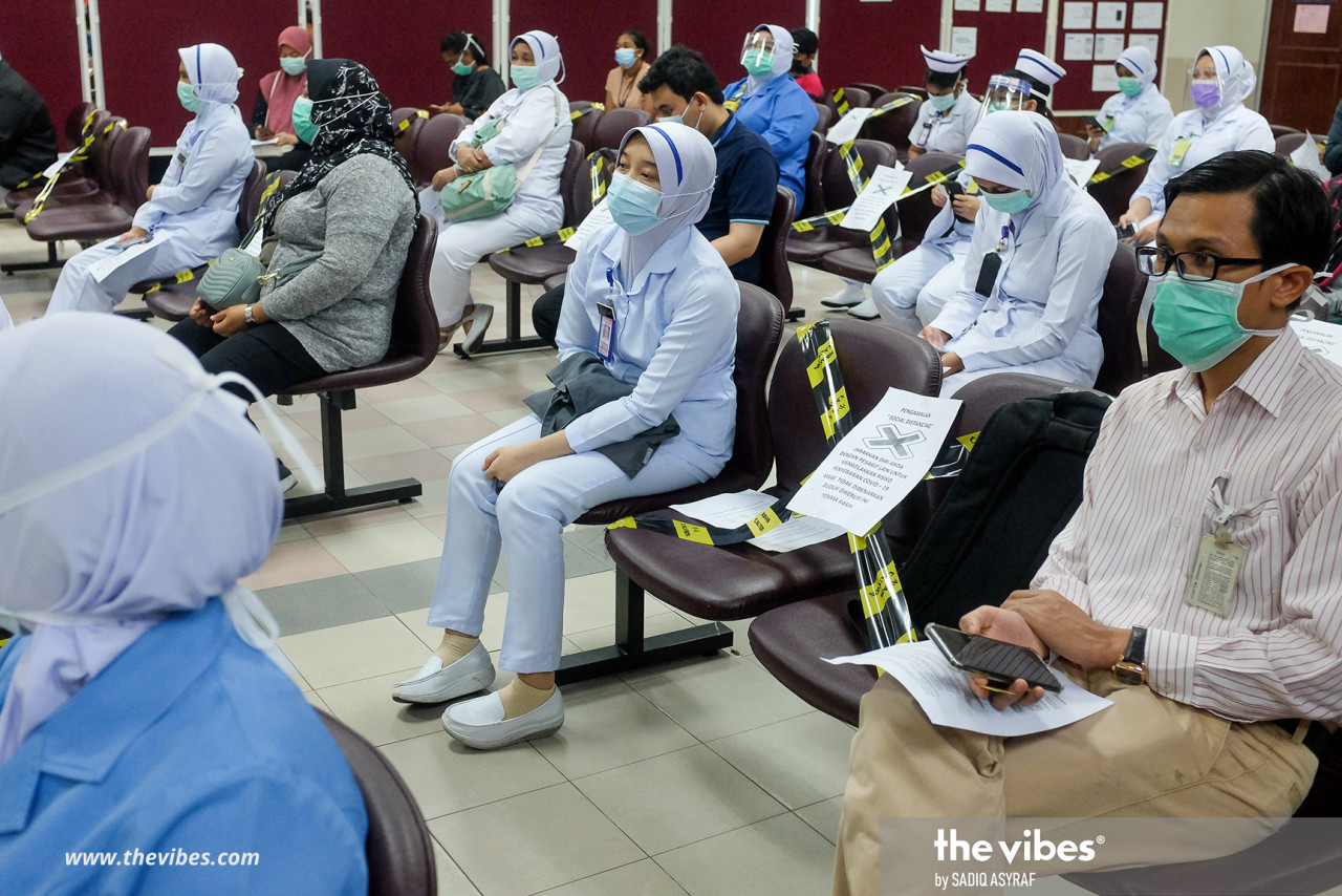 Health frontliners waiting for their turn to receive the Covid-19 vaccine at Kuala Lumpur Hospital yesterday. – SADIQ ASYRAF/The Vibes pic, March 2, 2021