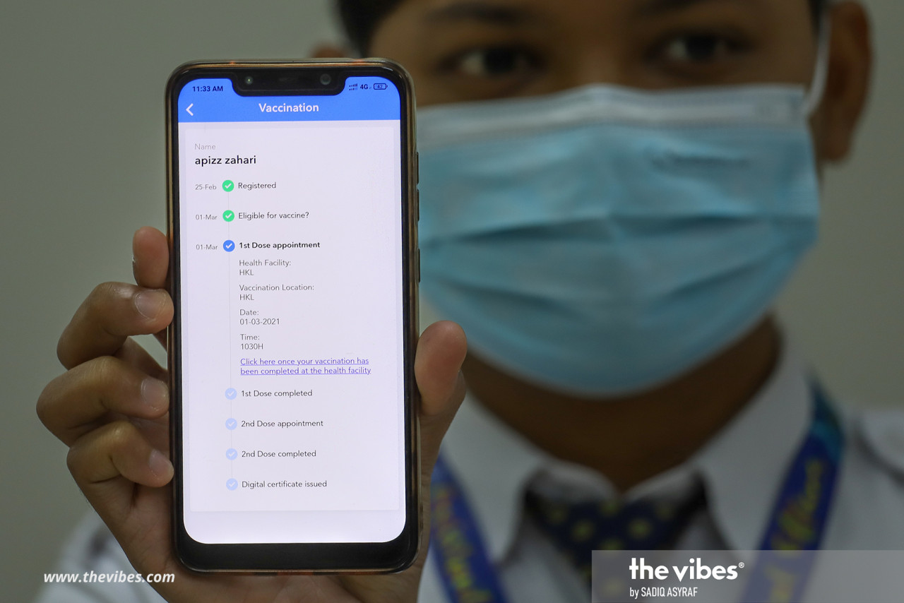 A frontliner showing his vaccination profile on the MySejahtera app after getting his first vaccine shot. – SADIQ ASYRAF/The Vibes pic, March 2, 2021