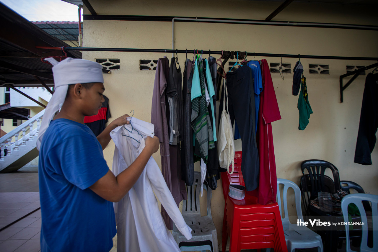 Students at Maahad Tahfiz Al-Mawaddah school in Puchong, Selangor wash and dry their laundry as part of their daily morning routine. – AZIM RAHMAN/The Vibes pic, April 9, 2023