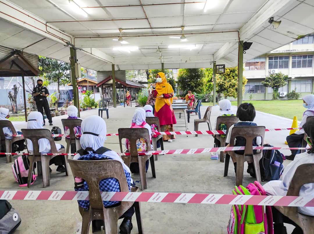 Pupils being briefed by teachers on health SOP to be observed while in school yesterday. – The Vibes pic, March 2, 2021