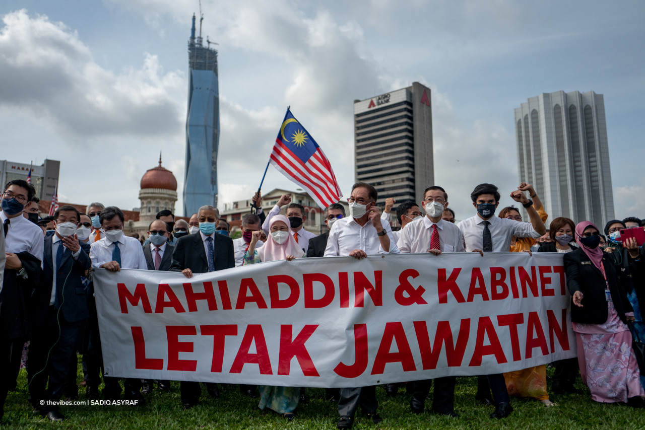 Opposition leaders holding a banner criticising the federal government at Dataran Merdeka. – SADIQ ASYRAF/The Vibes pic, August 2, 2021