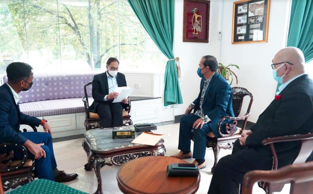 PKR president Datuk Seri Anwar Ibrahim going through statutory declarations expressing the withdrawal of support for Sabah PKR chairman Christina Liew, submitted by the Penampang, Kota Marudu and Labuan divisional chiefs. – The Vibes pic, December 3, 2021