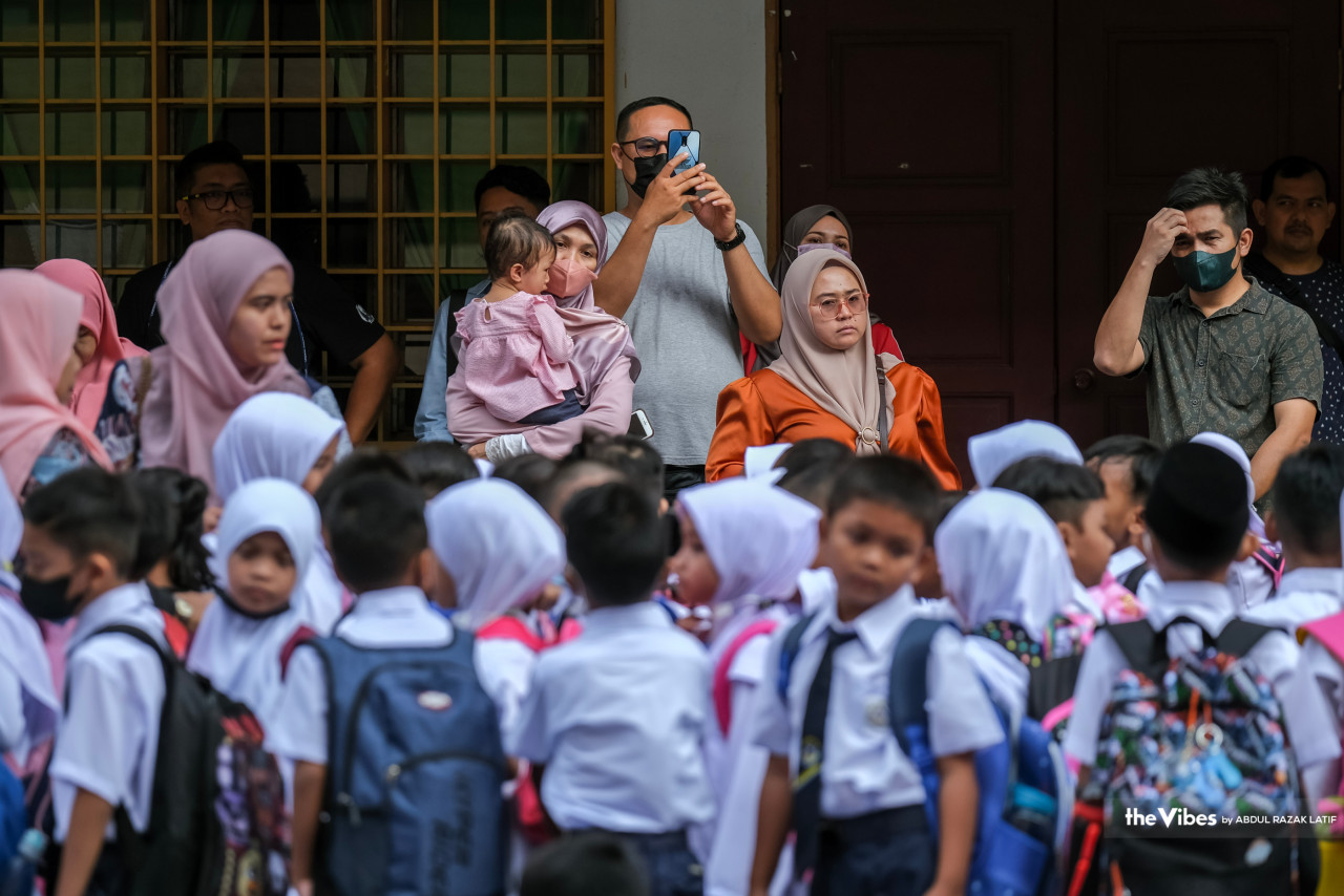 Parents look on as their children gather for the first day of the 2023/2024 school session. – ABDUL RAZAK LATIF/The Vibes pic, March 20, 2023