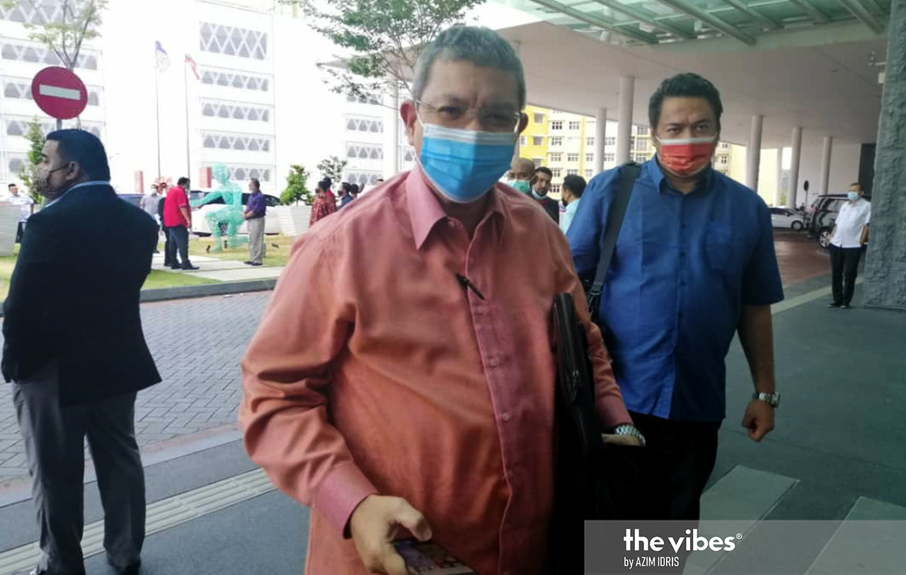 Communications and Multimedia Minister Datuk Saifuddin Abdullah arriving at the Everly Hotel in Putrajaya for the Bersatu meeting today. – AZIM IDRIS/The Vibes pic, March 4, 2021