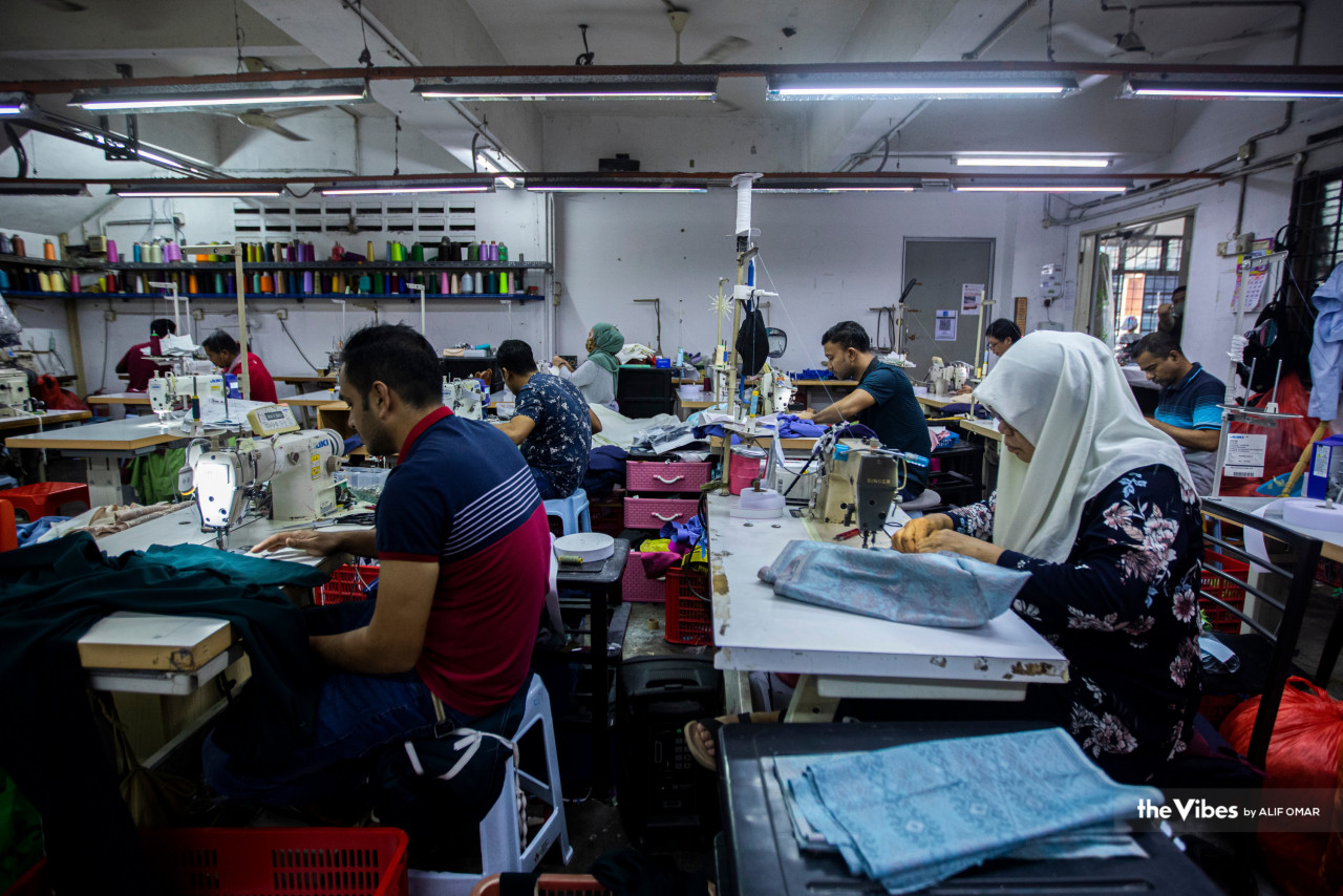 A visit to Omar Ali Taylor in Kg Baru sees workers rushing to complete the festive clothing orders in time for Hari Raya. – ALIF OMAR/The Vibes pic, April 20, 2023