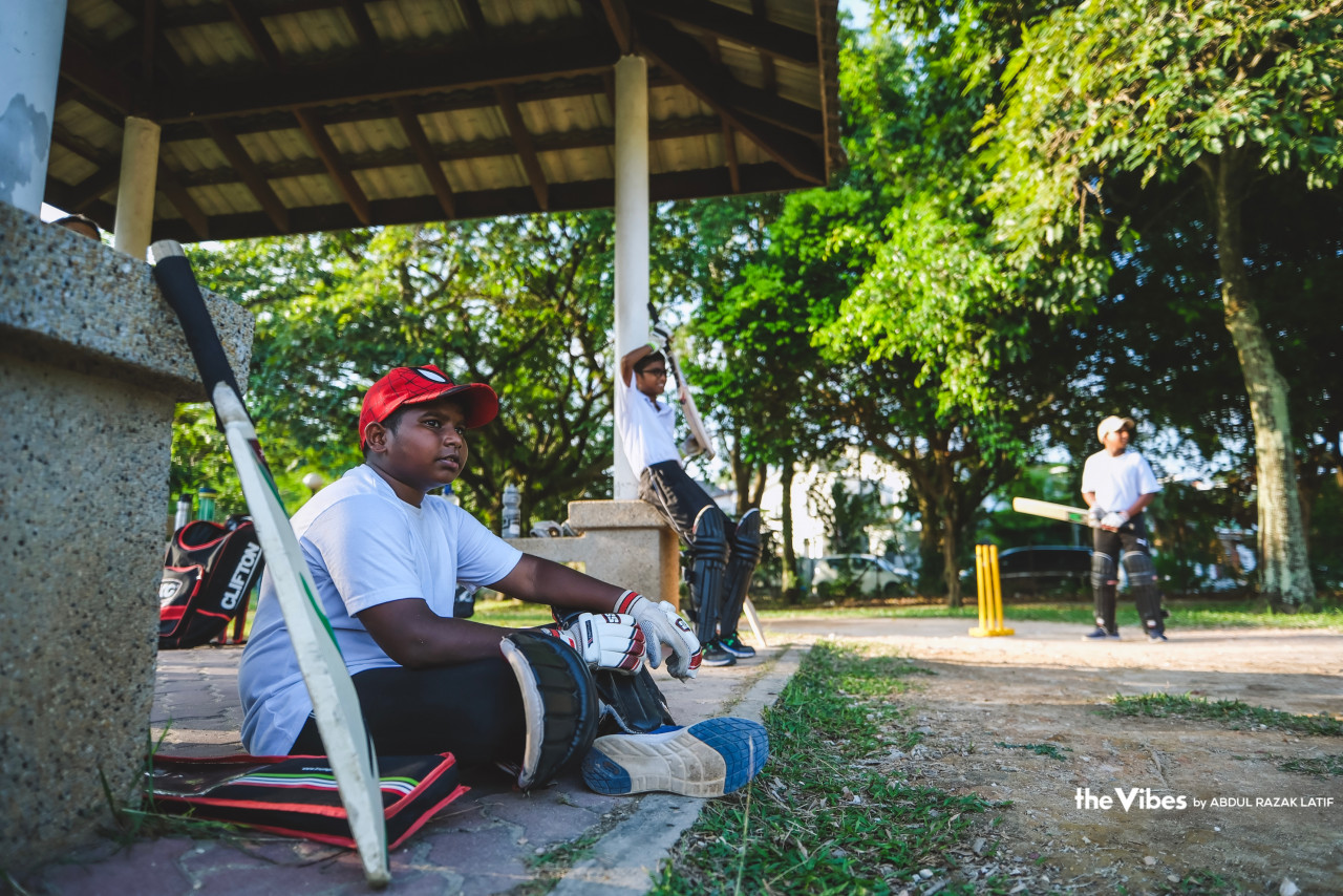 A boy sits at the side to record the score while waiting for his turn to bat. – ABDUL RAZAK LATIF/The Vibes pic, June 19, 2023