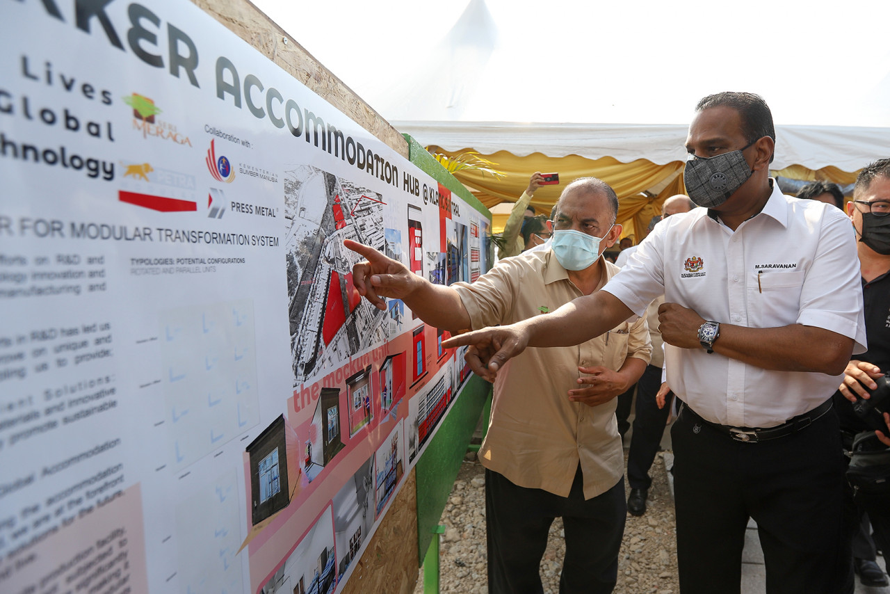 Human Resources Minister Datuk Seri M. Saravanan (right) looking at plans after officiating the launch of the Workers’ Accommodation Hub in Klang Sentral on Friday. – SADIQ ASYRAF/The Vibes pic, March 7, 2021