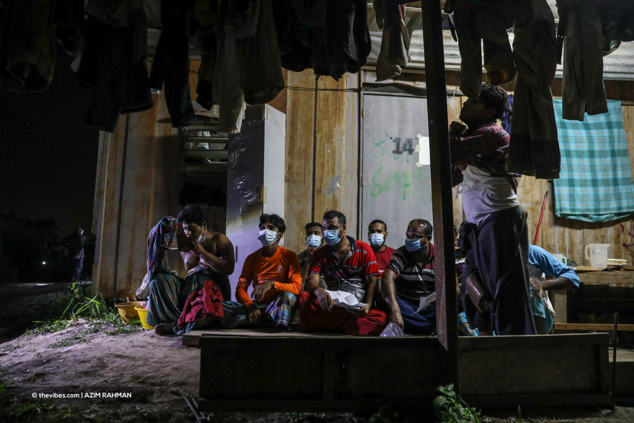 Some of the migrants waiting for checks at the illegal settlement in Cyberjaya during last night’s raid. – AZIM RAHMAN/The Vibes pic, June 7, 2021