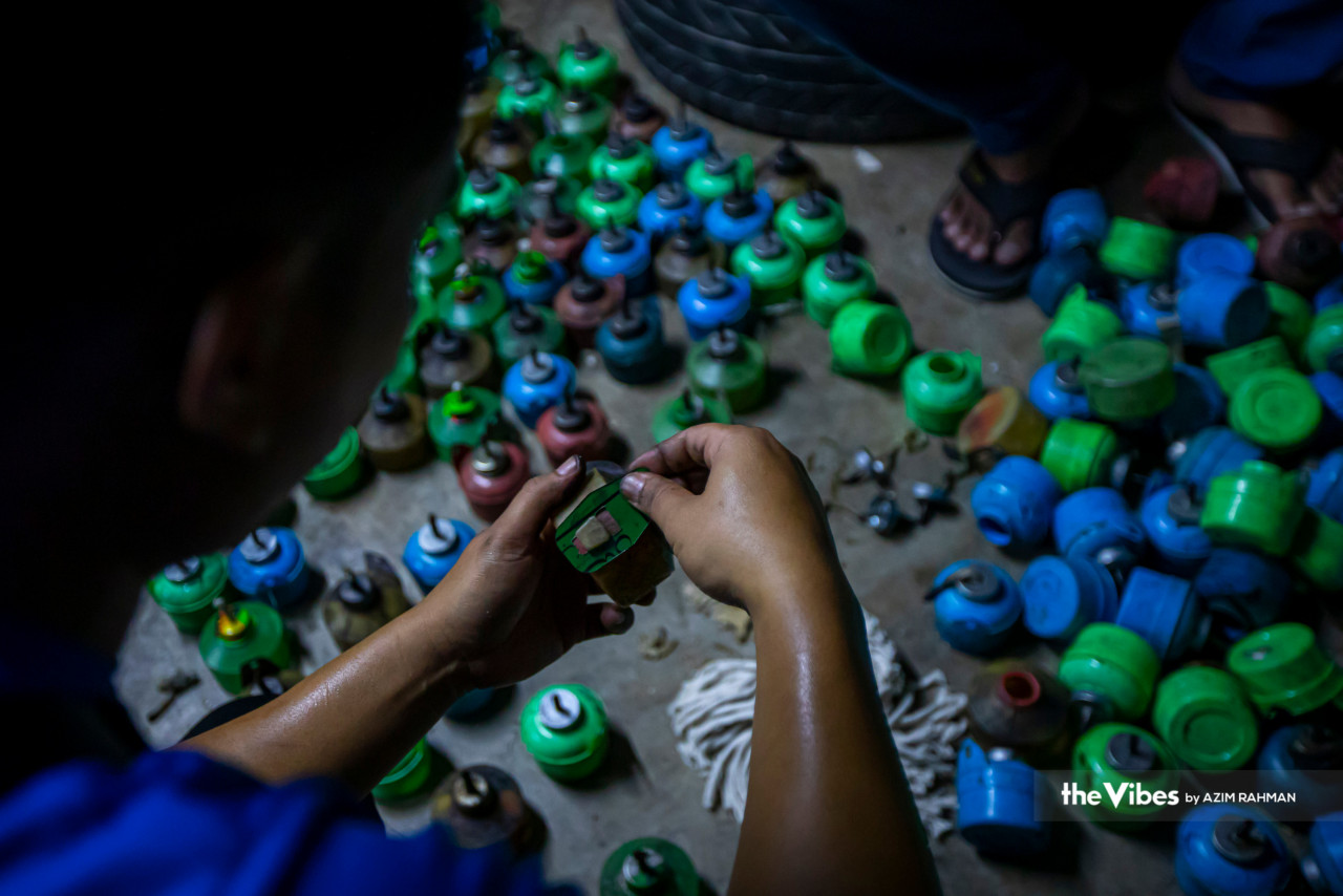 The villagers of Kg Jenjarom work together to install colourful lights to liven up the village. – AZIM RAHMAN/The Vibes pic, April 21, 2023