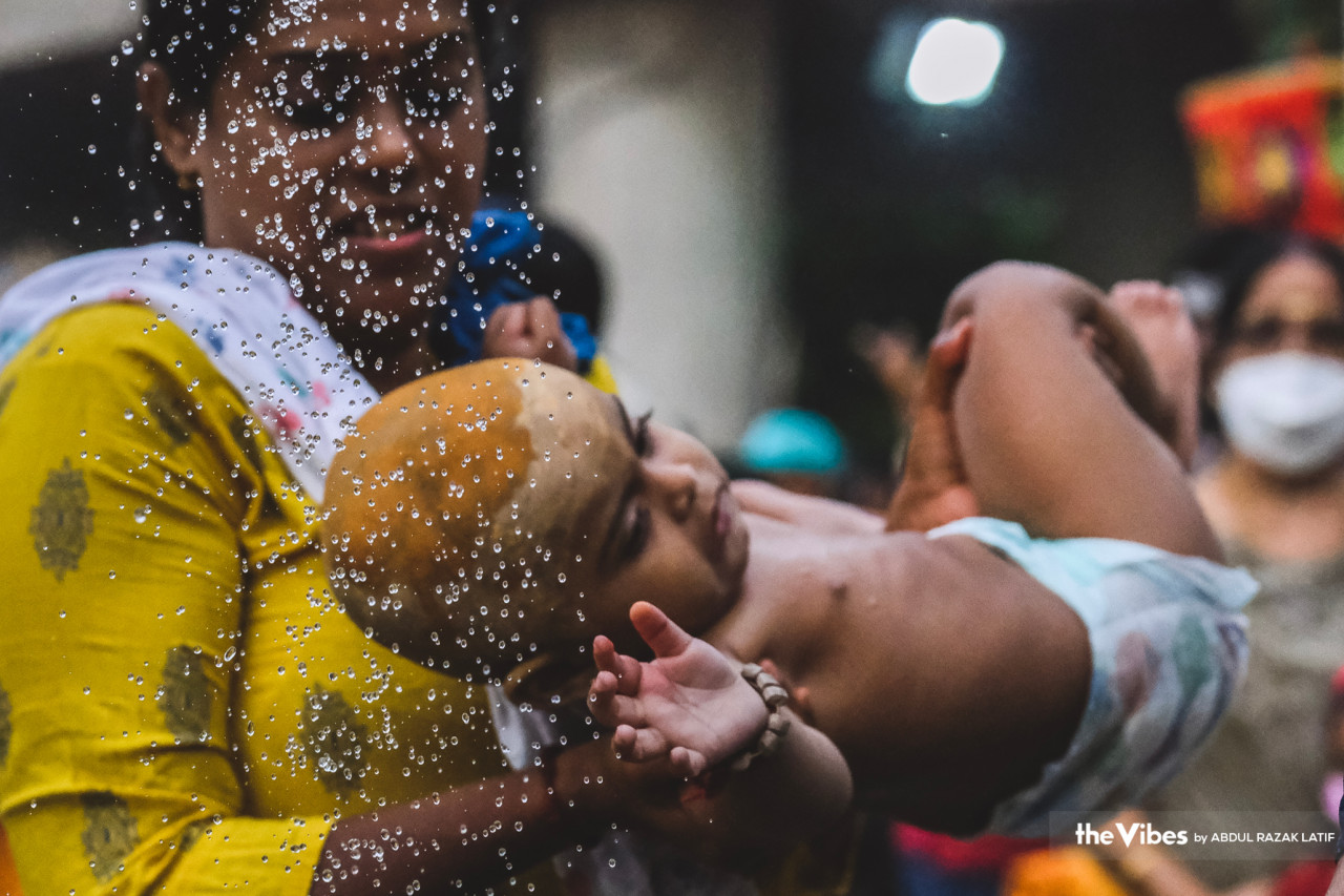 Not only the old undergo cleansing on Thaipusam day, as an infant here is seen receiving blessings at the temple. – ABDUL RAZAK LATIF/The Vibes pic, February 6, 2023
