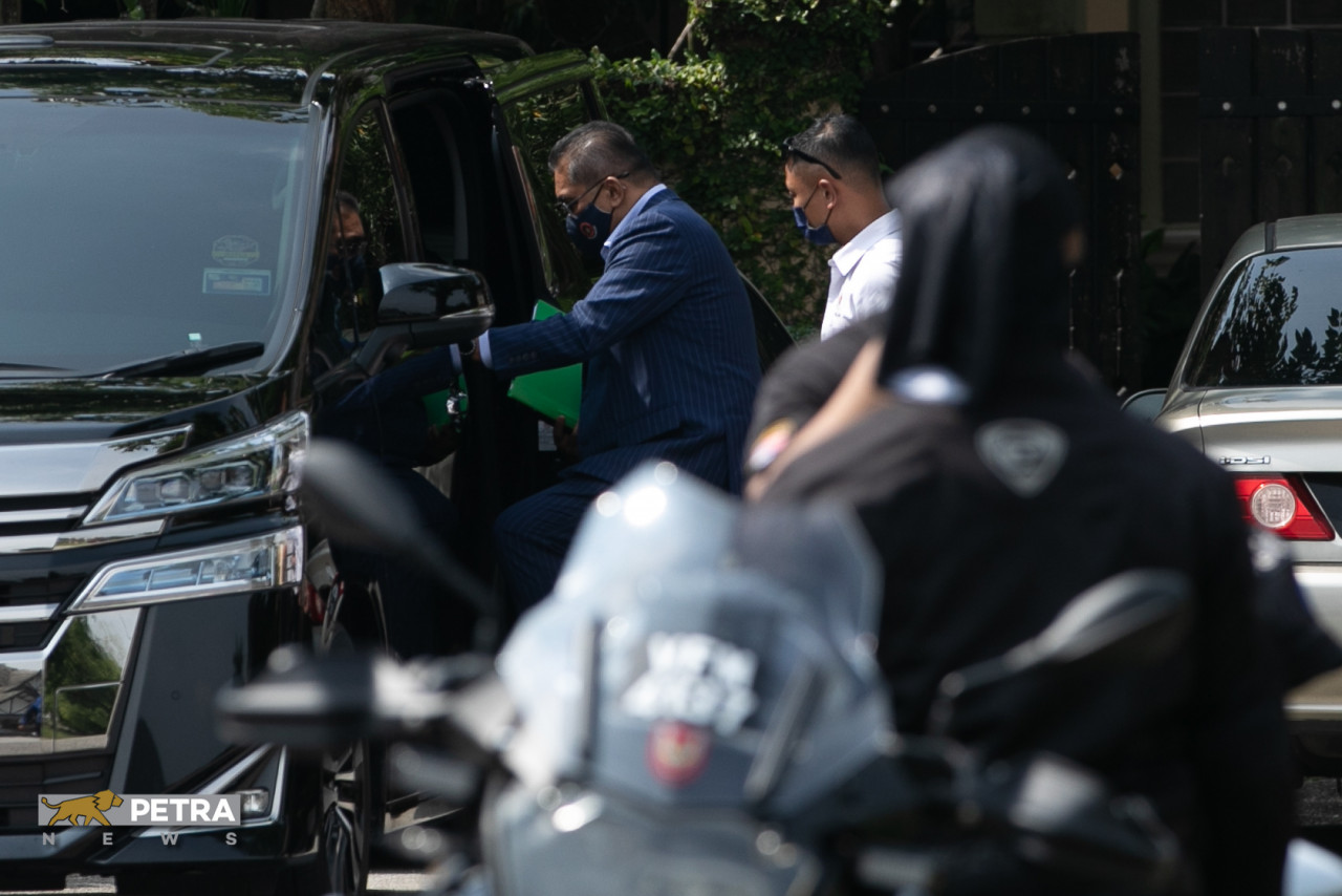 Minister in the Prime Minister's Department Datuk Seri Takiyuddin Hassan entering his car at the residence earlier today. – SAIRIEN NAFIS/PETRA News pic, July 8, 2021