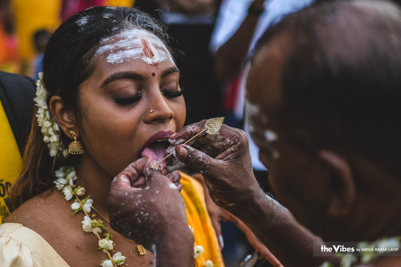 A devotee gets her tongue pierced as a sign of devotion to Lord Murugan. – ABDUL RAZAK LATIF/The Vibes pic, February 6, 2023