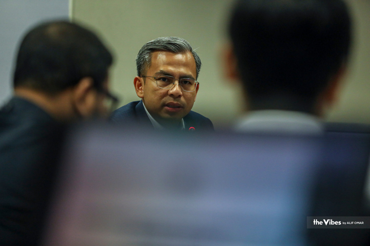 Fahmi Fadzil (centre) says the telcos participating in entities A or B have yet to be decided and that the commencement of the latter’s operations depends on the telcos reaching a decision on the matter. – ALIF OMAR/The Vibes pic, May 26, 2023