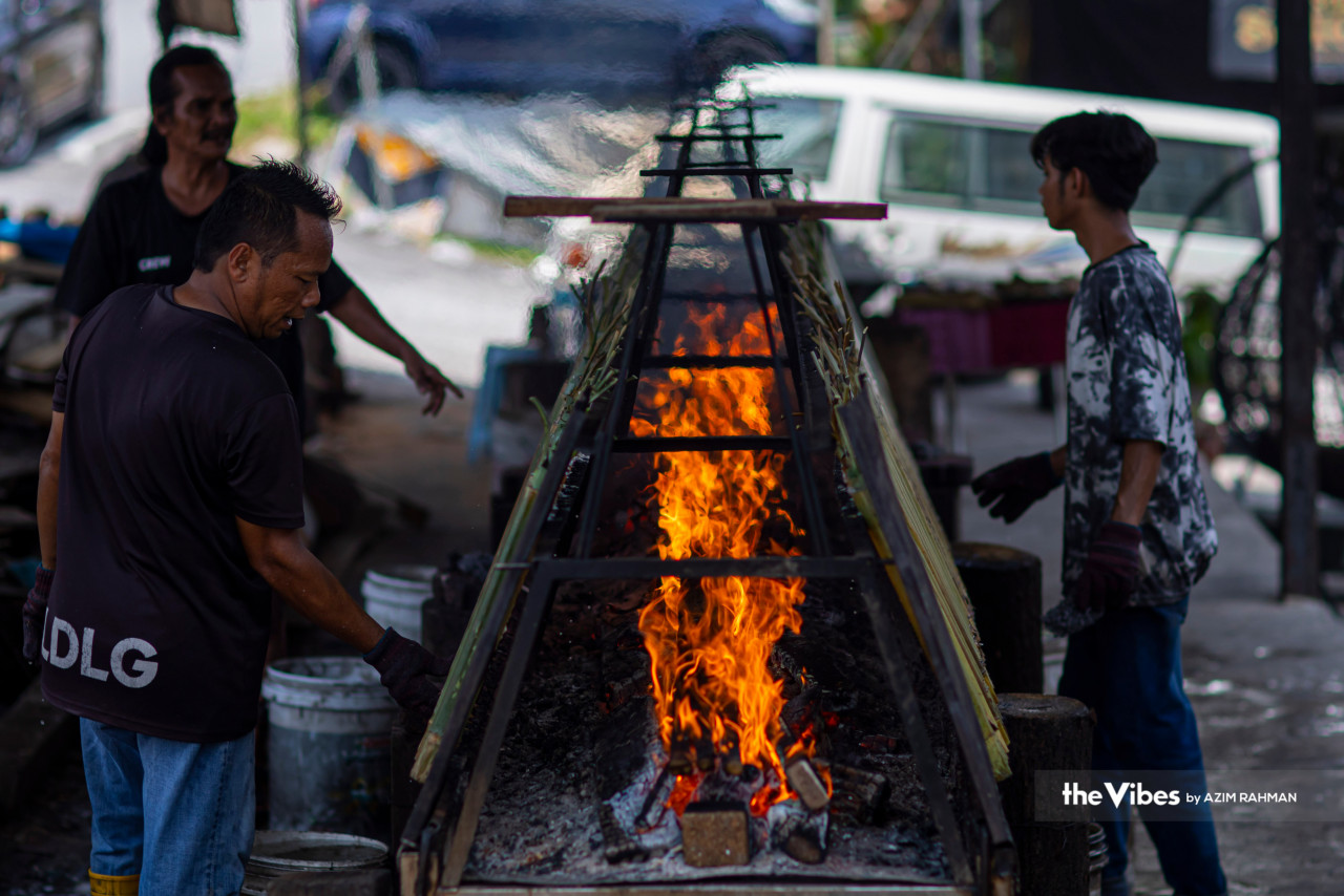 Lemang Daun Lerek Greenwood is cooked on an open fire with consistent supervision so that it is not overdone. – AZIM RAHMAN/The Vibes pic, April 17, 2023