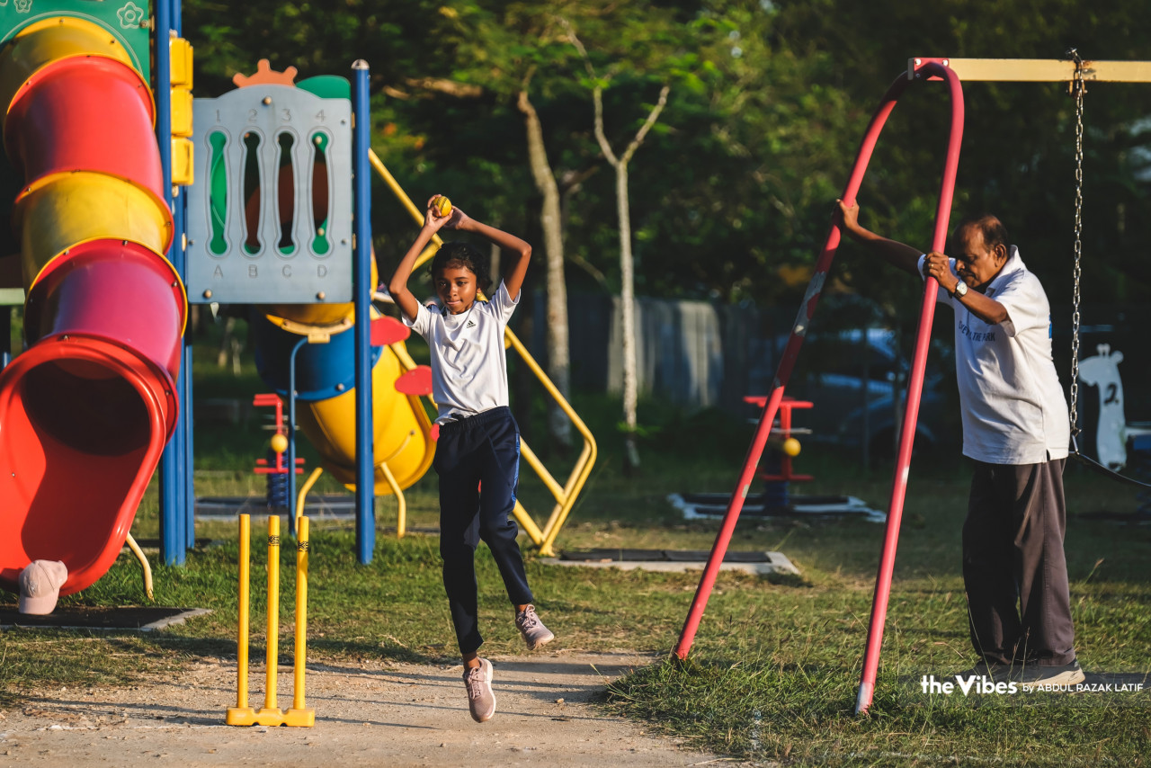 Fernandez making sure his granddaughter Kaelynn, 11, practised her routine correctly as she was taught. – ABDUL RAZAK LATIF/The Vibes pic, June 19, 2023