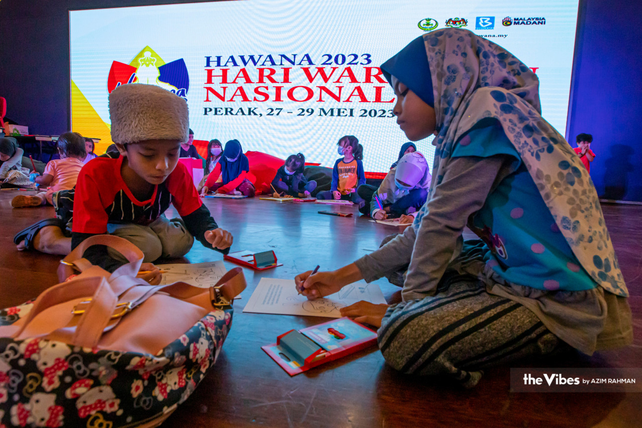 Children participate in a colouring competition, among the activities held in conjunction with Hawana 2023. – AZIM RAHMAN/The Vibes pic, May 30, 2023