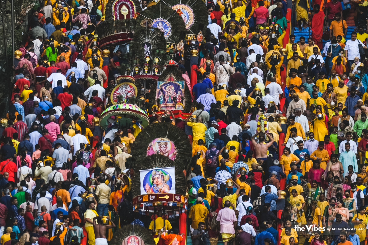 Hundreds of thousands of people throng the steps at Batu Caves to reach the temple inside, wearing bright colours and carrying Lord Murugan iconography. – ABDUL RAZAK LATIF/The Vibes pic, February 6, 2023