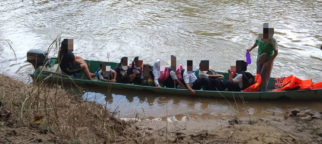 Students in the Pitas district use a boat to cross a river in order to get to school. Pitas consistently ranks as one of the poorest districts in the country. – Pic courtesy of Eddword Upak, May 9, 2022
