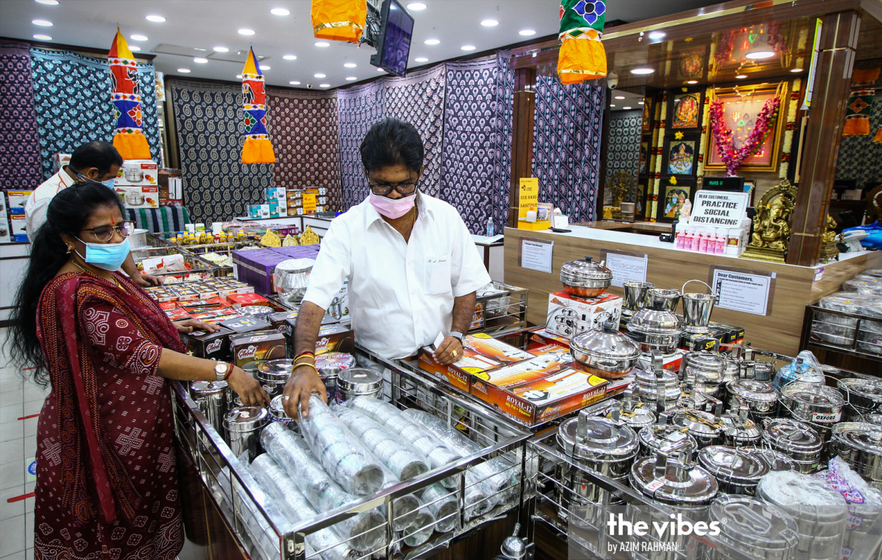 M.S. Kumar (centre), owner of Arjuntha Textiles Sdn Bhd says he has been forced to take textiles – his main product – off the shelves to merely keep the store open. – AZIM RAHMAN/The Vibes pic, January 24, 2021
