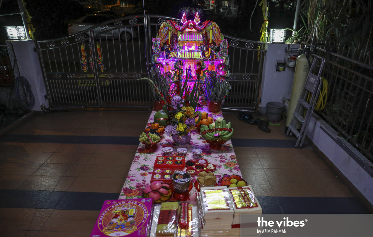 A full spread on an altar table that includes sweet cakes, red tortoise buns, red-colored buns, prosperity cakes and pagodas. – AZIM RAHMAN/The Vibes pic, February 20, 2021