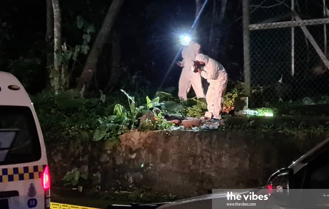 Police officers at the site where the body of a woman was found near a hotel in Bandaran Berjaya, Kota Kinabalu, last night. – The Vibes pic, January 20, 2021
