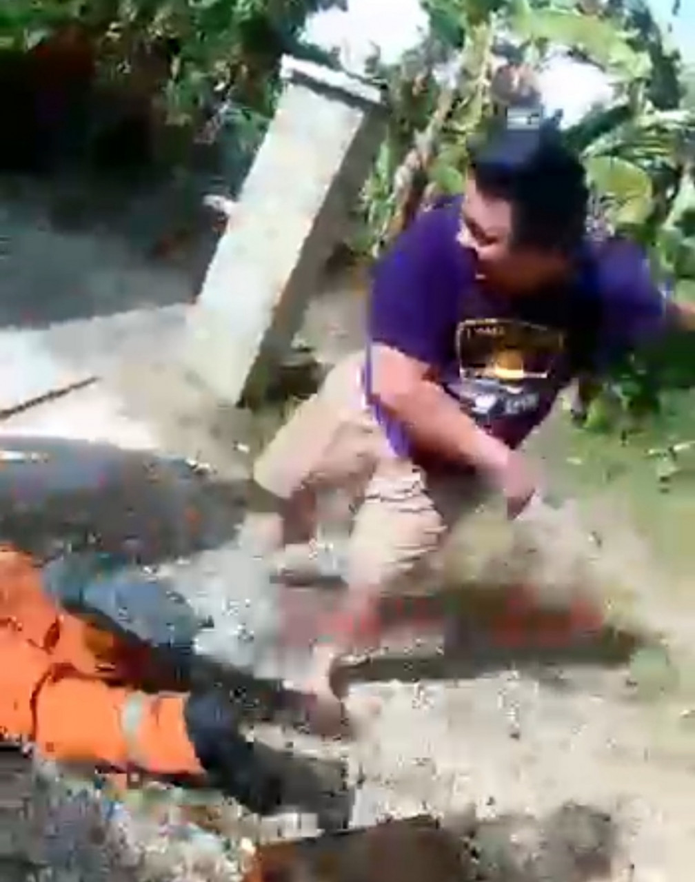 A still from a video showing a firefighter being hit by a man in Lawas, northern Sarawak yesterday. – Screengrab pic, June 20, 2021